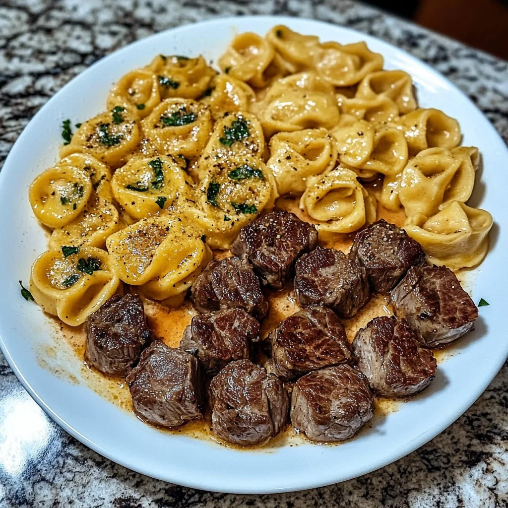 SMOTHERED STEAK BITES IN CREAMY VELVEETA TORTELLINI