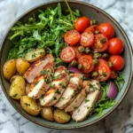 Herbed Chicken Bowl with Crispy Potatoes & Tomato Caper Salad